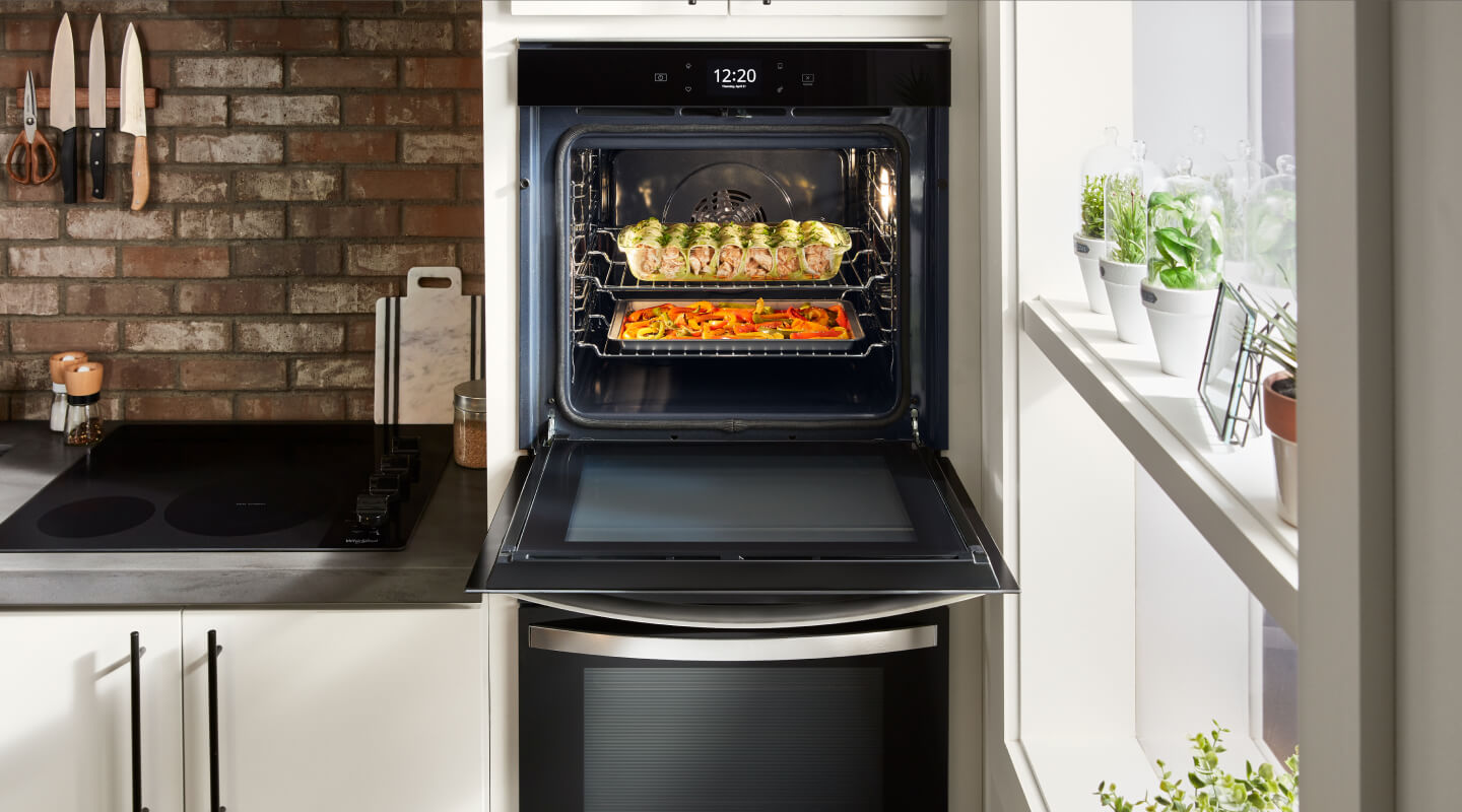 Food inside an open wall oven