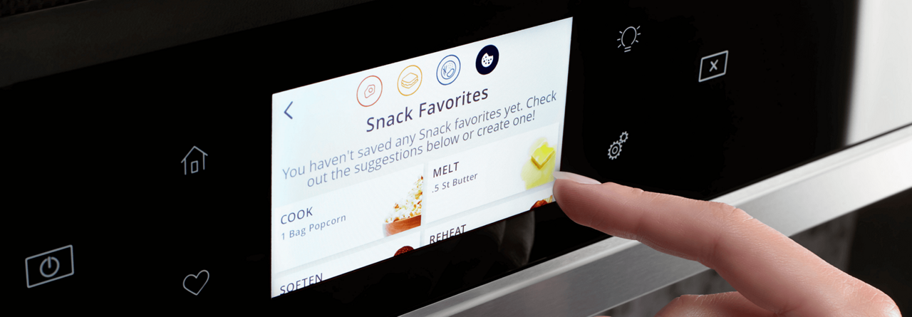 A hand selecting cooking settings on a smart microwave touch screen.