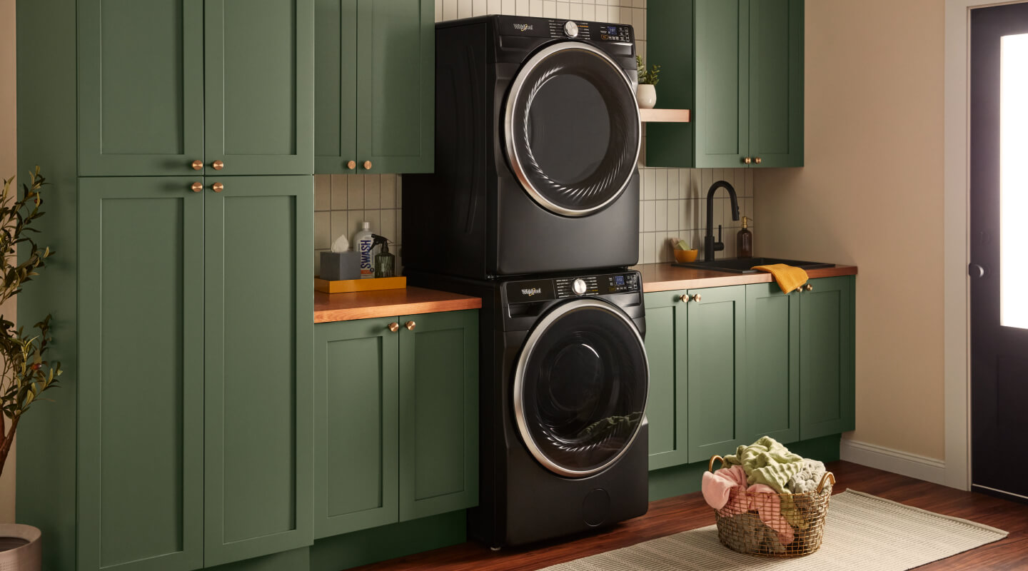  A set of black laundry appliances stacked on top of each other