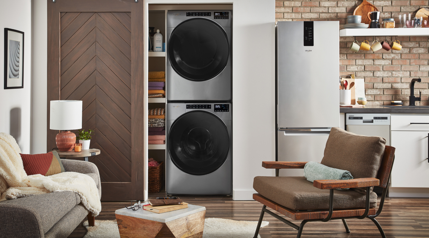 Whirlpool® stackable washer and dryer inside a closet