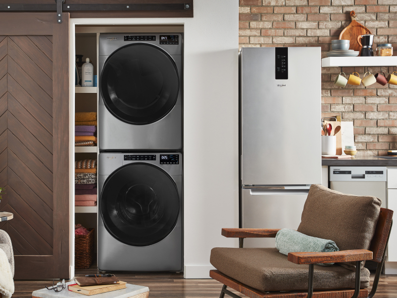 Whirlpool® stackable washer and dryer inside a closet