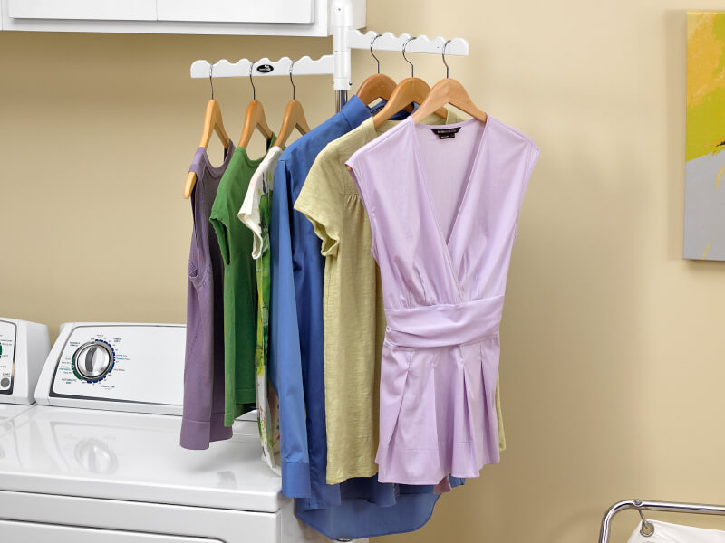 Clothing on hangers on a drying rack
