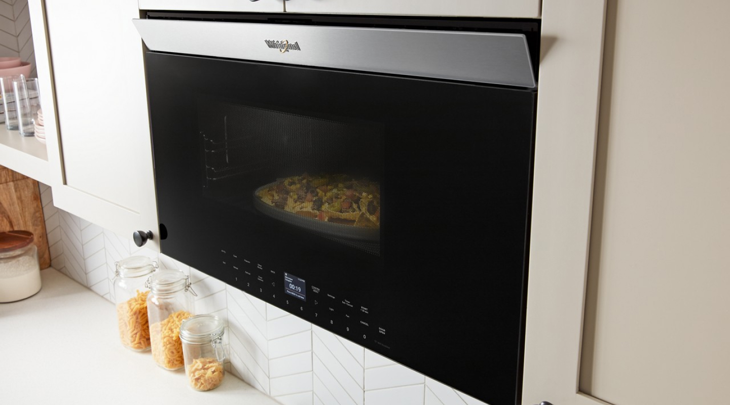 Whirlpool® Over-the-Range Microwave in off-white cabinetry