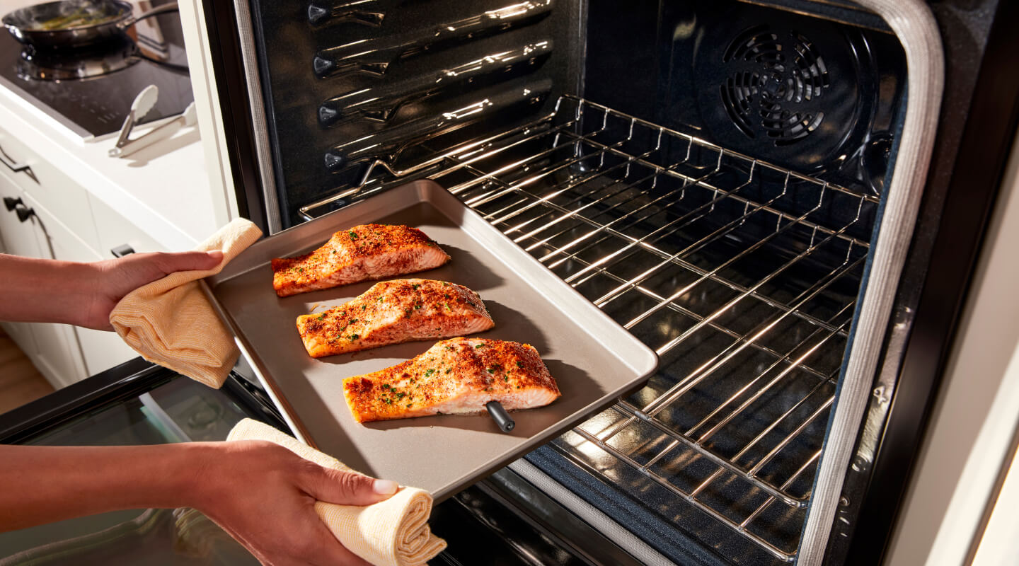 Putting salmon into the oven