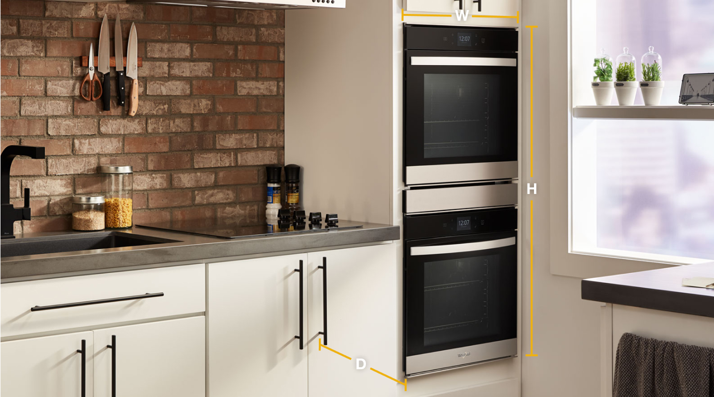 Graphic with wall oven set in cream cabinetry and dimensions shown