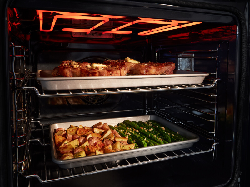  Inside of an oven with food cooking