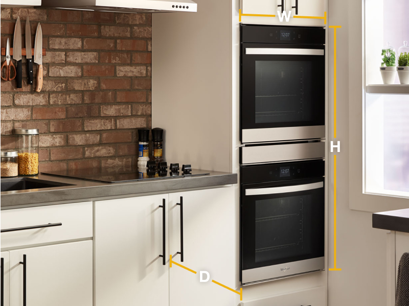 Graphic with wall oven set in cream cabinetry and dimensions shown