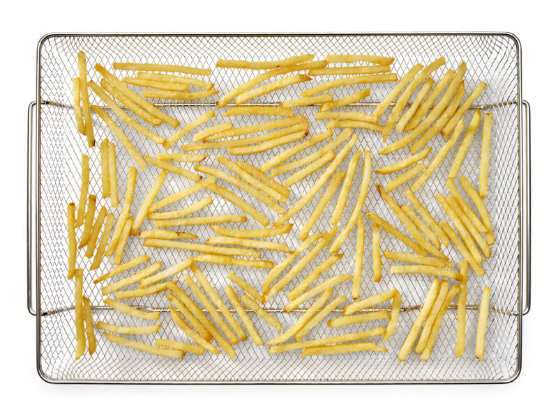 French fries in an air fryer basket