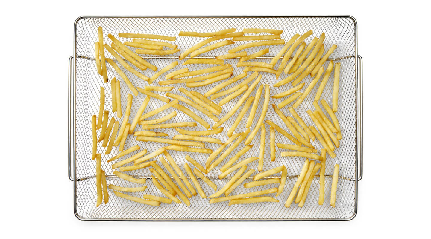 French fries in an air fryer basket
