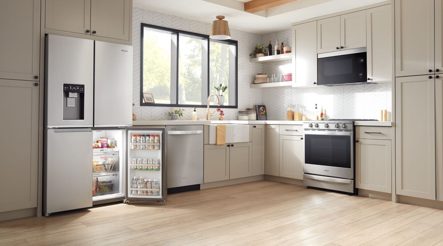 Stainless steel kitchen appliances in a bright kitchen