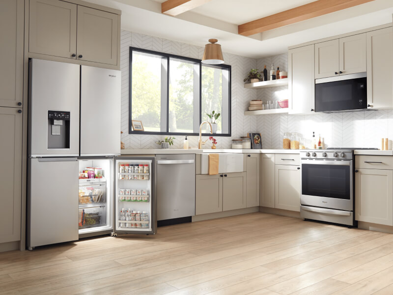 Stainless steel kitchen appliances in a bright kitchen