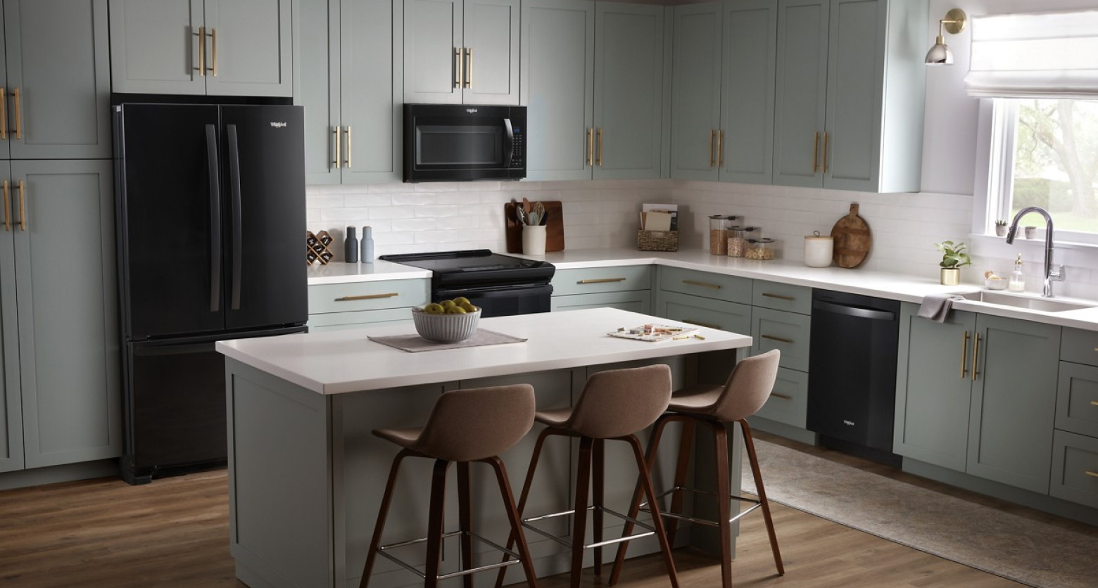 Gray kitchen featuring Whirlpool®  appliances in black