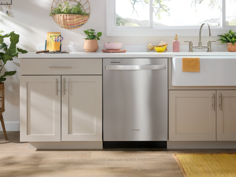Stainless steel Whirlpool® Dishwasher in bright, modern cabinetry