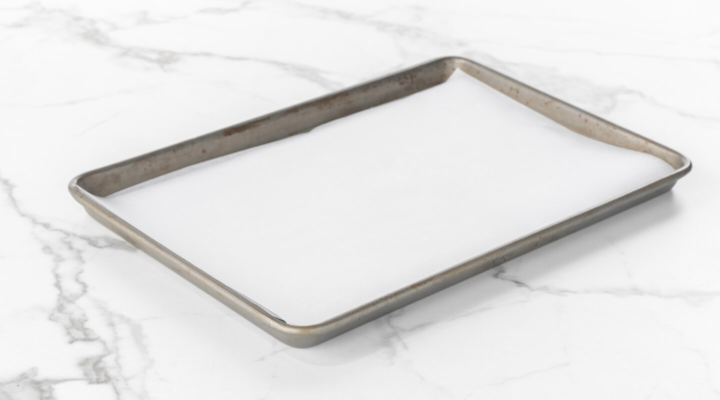 Baking sheet lined with parchment paper