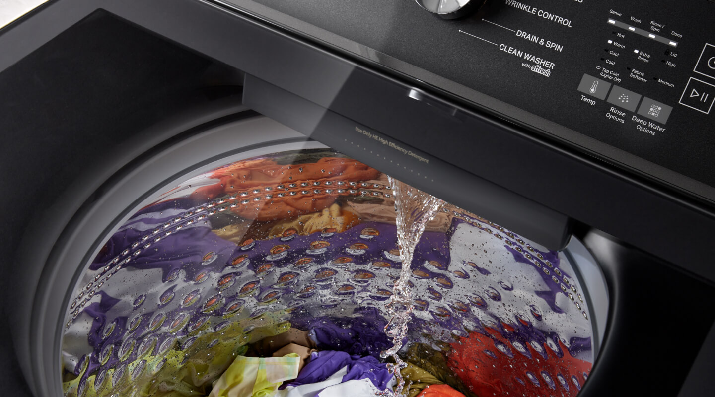 Water pouring into a washing machine
