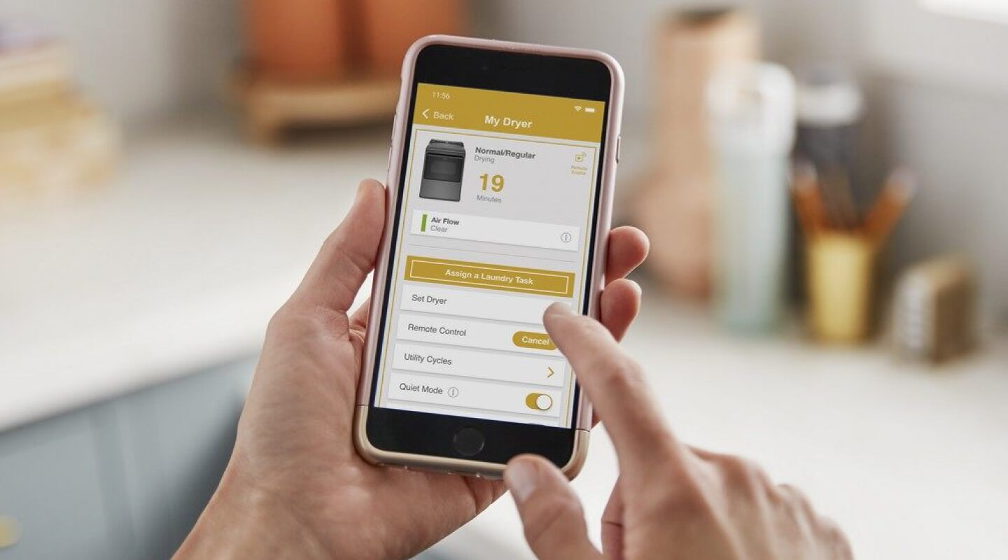 Person using the Whirlpool® App on a smartphone