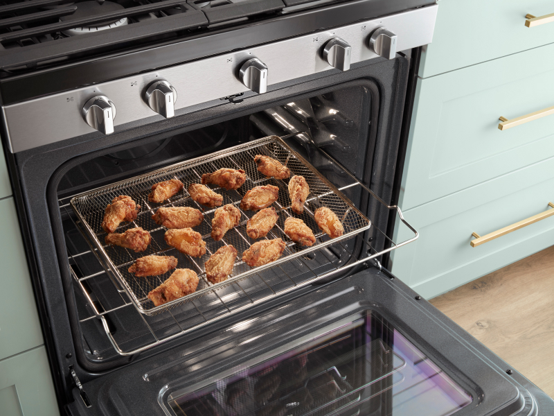 Wings on the Air Fryer Basket inside a Whirlpool® Gas Range
