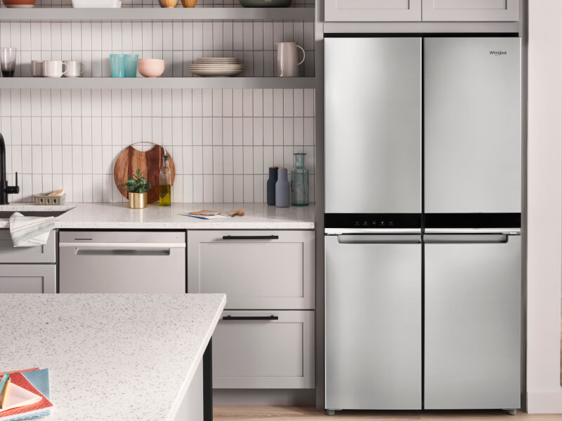 A bright kitchen with a Whirlpool® 4 Door Refrigerator in stainless steel