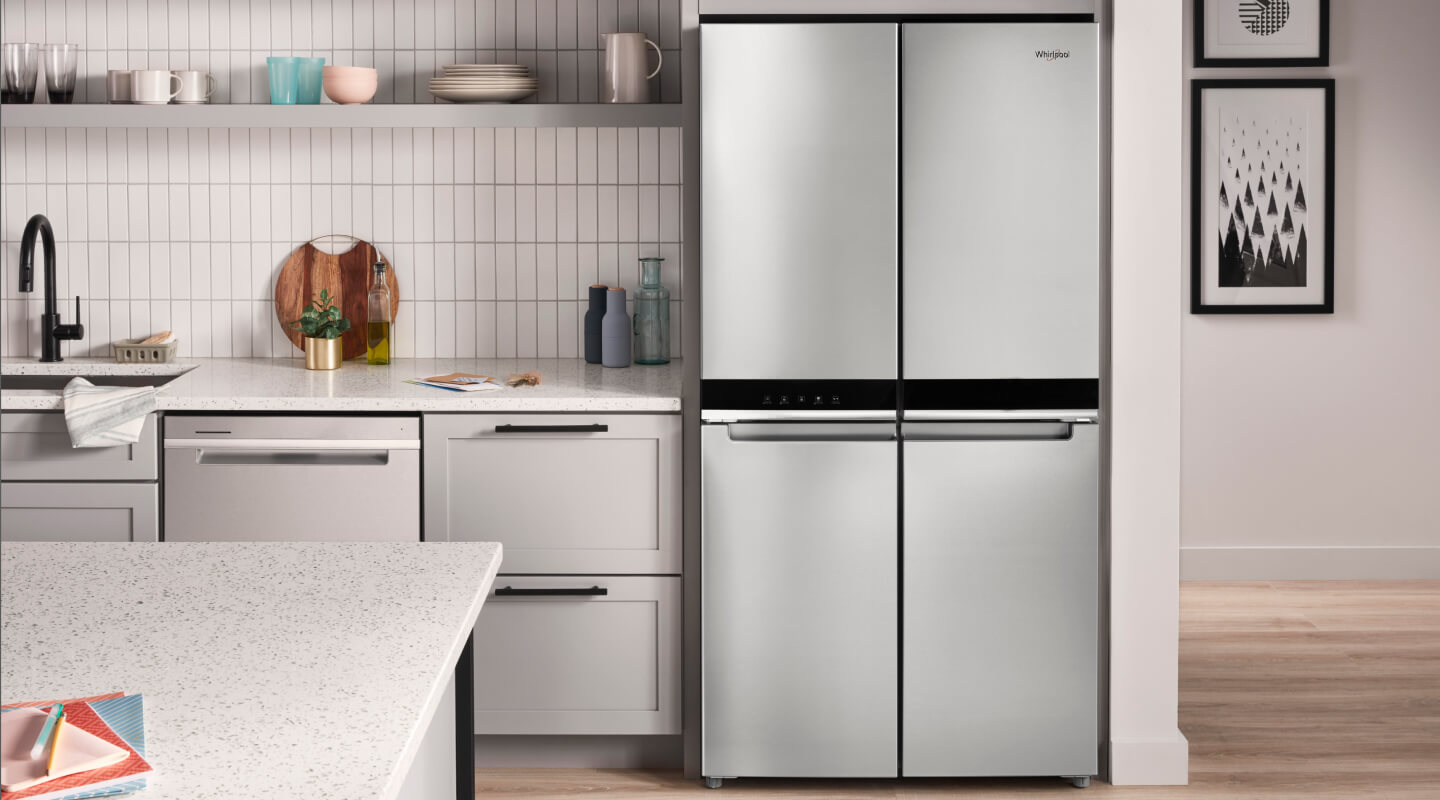 A bright kitchen with a Whirlpool® 4 Door Refrigerator in stainless steel