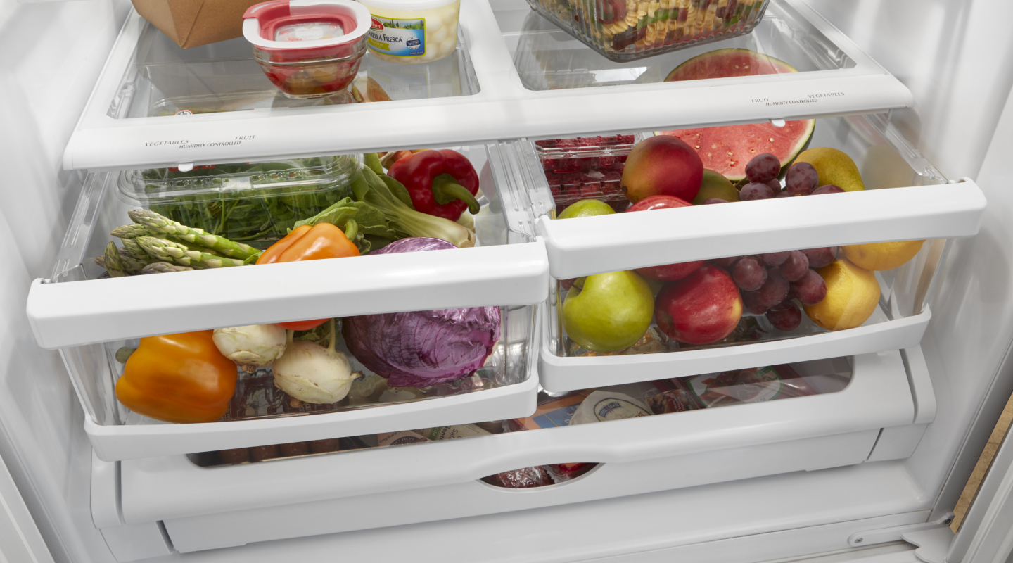 Open crisper drawers filled with food