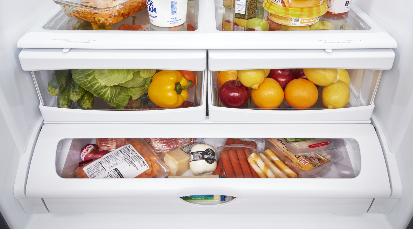 Closed crisper drawers filled with food