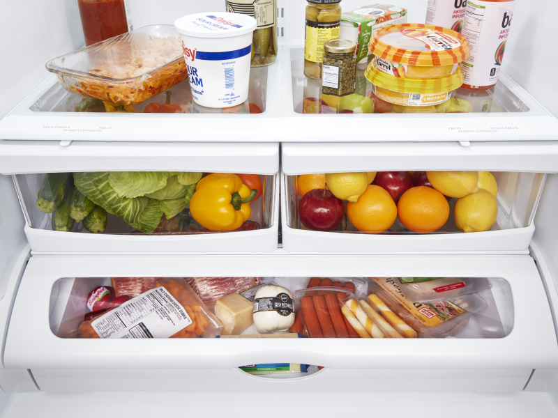 Closed crisper drawers filled with food