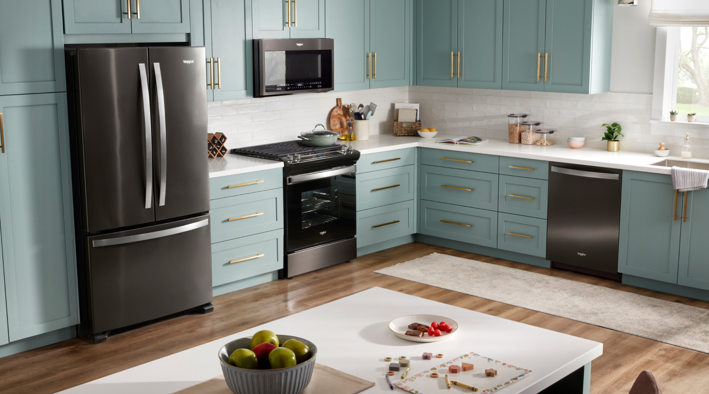 A stainless steel refrigerator set in a kitchen 