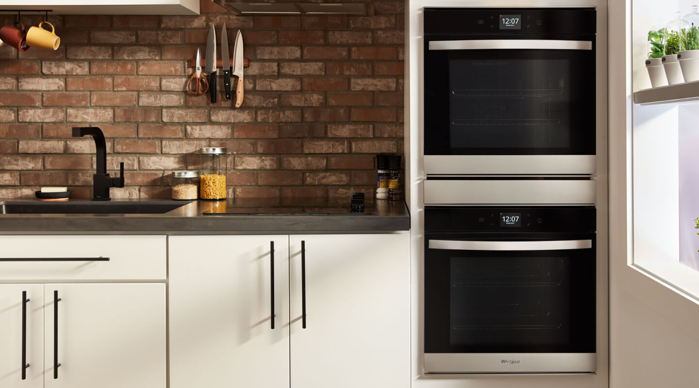 Whirlpool® stainless steel double wall oven in a contemporary kitchen
