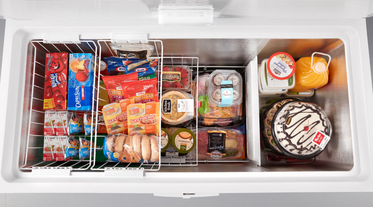 Aerial view of an open white chest freezer
