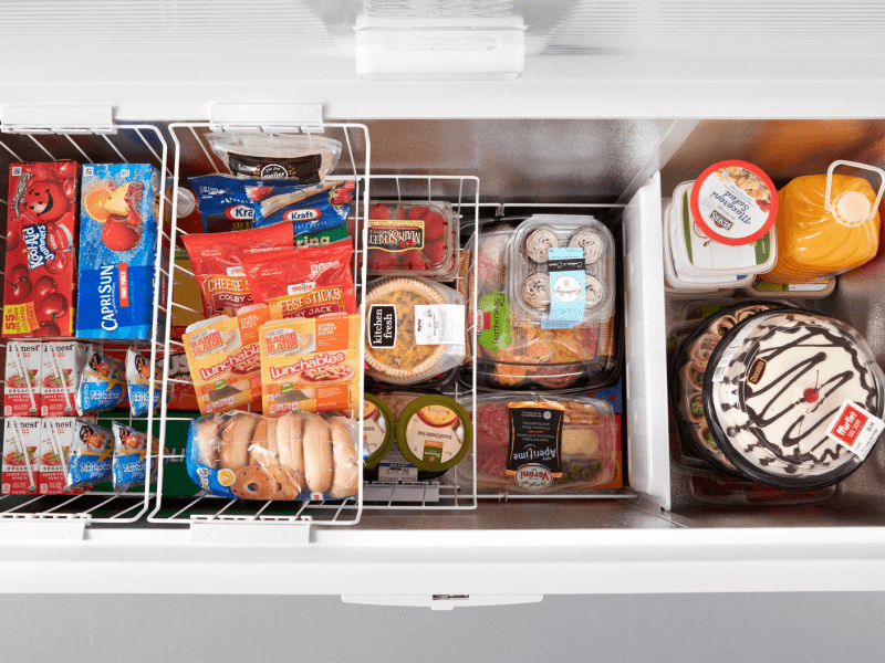 Aerial view of an open white chest freezer
