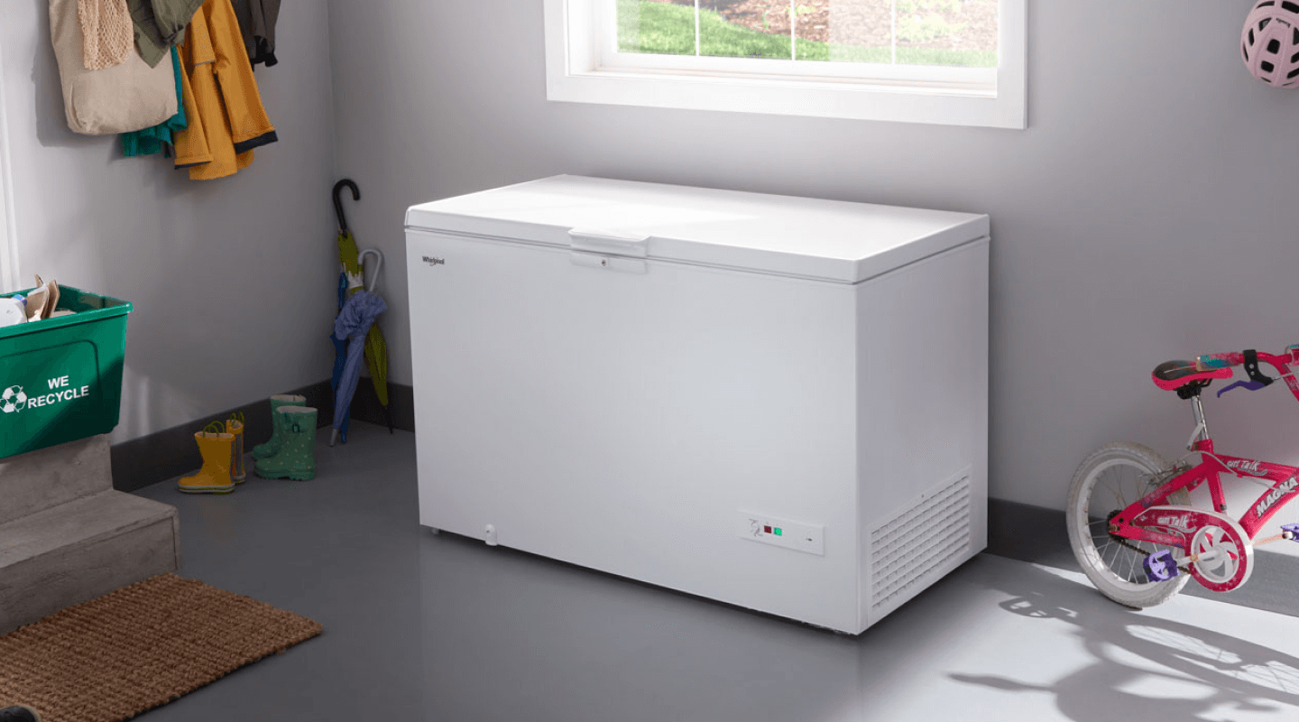White chest freezer in a garage