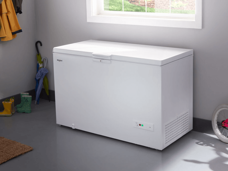 White chest freezer in a garage