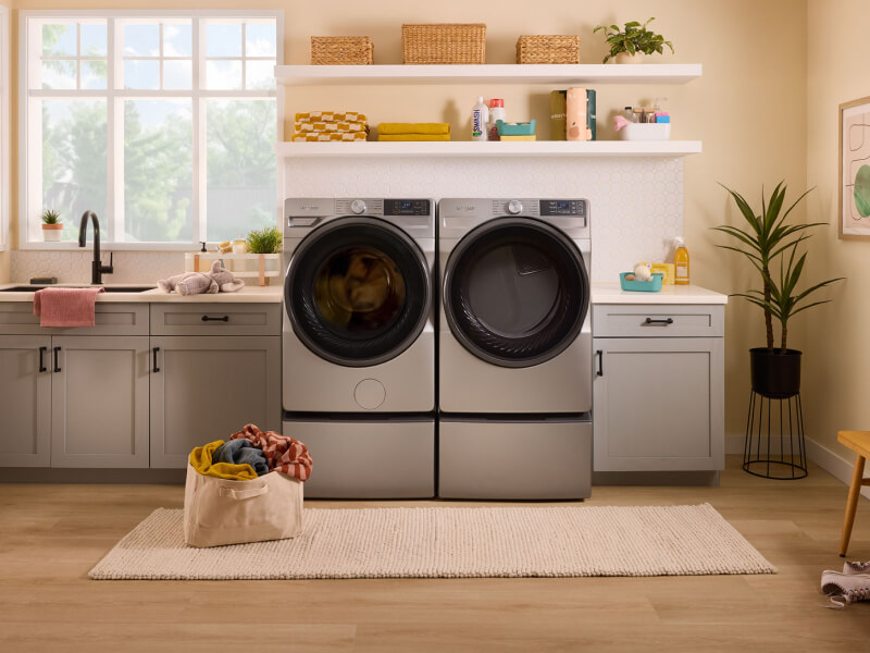 A Whirlpool® Washer and Dryer in a light colored laundry area