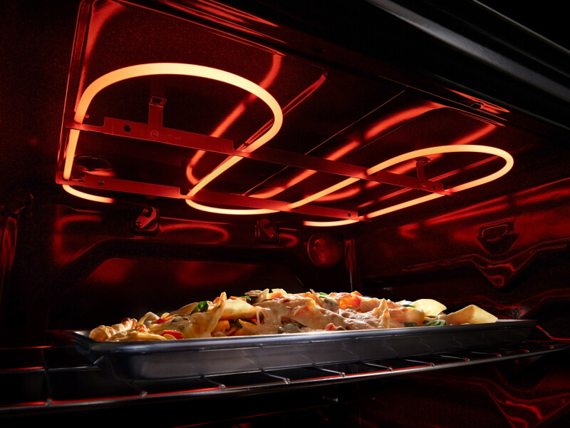 Nachos broiling in an electric oven