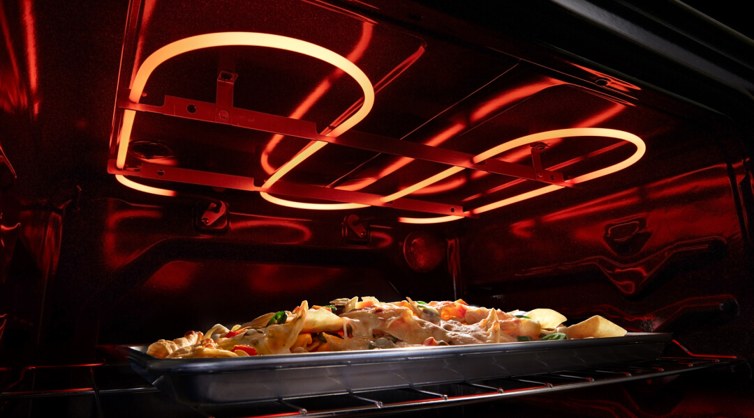 Nachos broiling in an electric oven