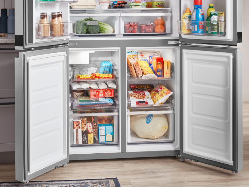 Freezer compartments of a four-door refrigerator full of food
