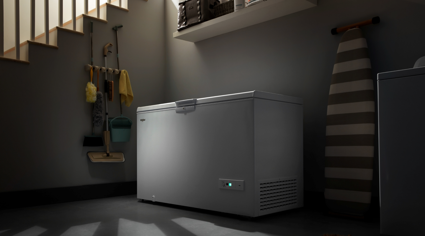 A white Whirlpool® deep freezer.