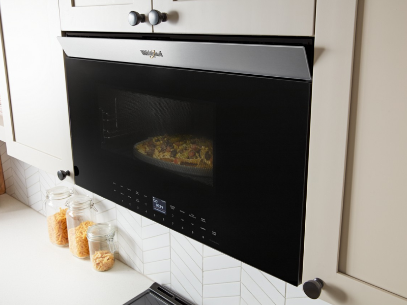 Nachos cooking inside a Whirlpool® Over-the-Range Microwave