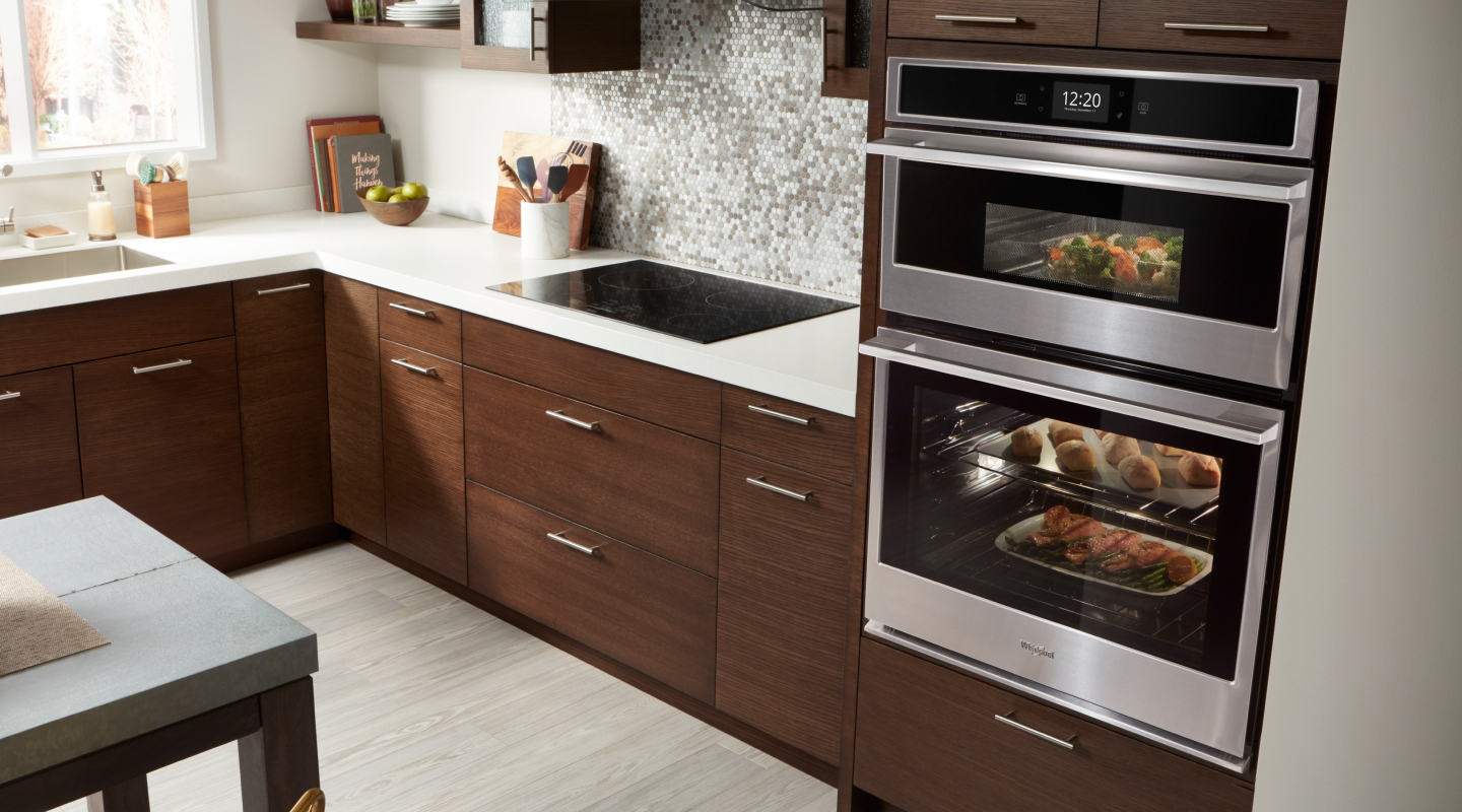 Whirlpool brand combination wall oven and microwave with food inside