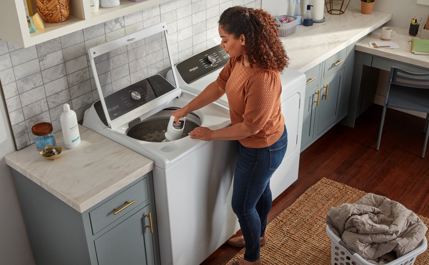 Person removing agitator from washing machine