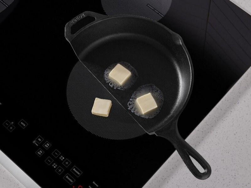 Butter in a cast iron pan melting on a Whirlpool® induction cooktop