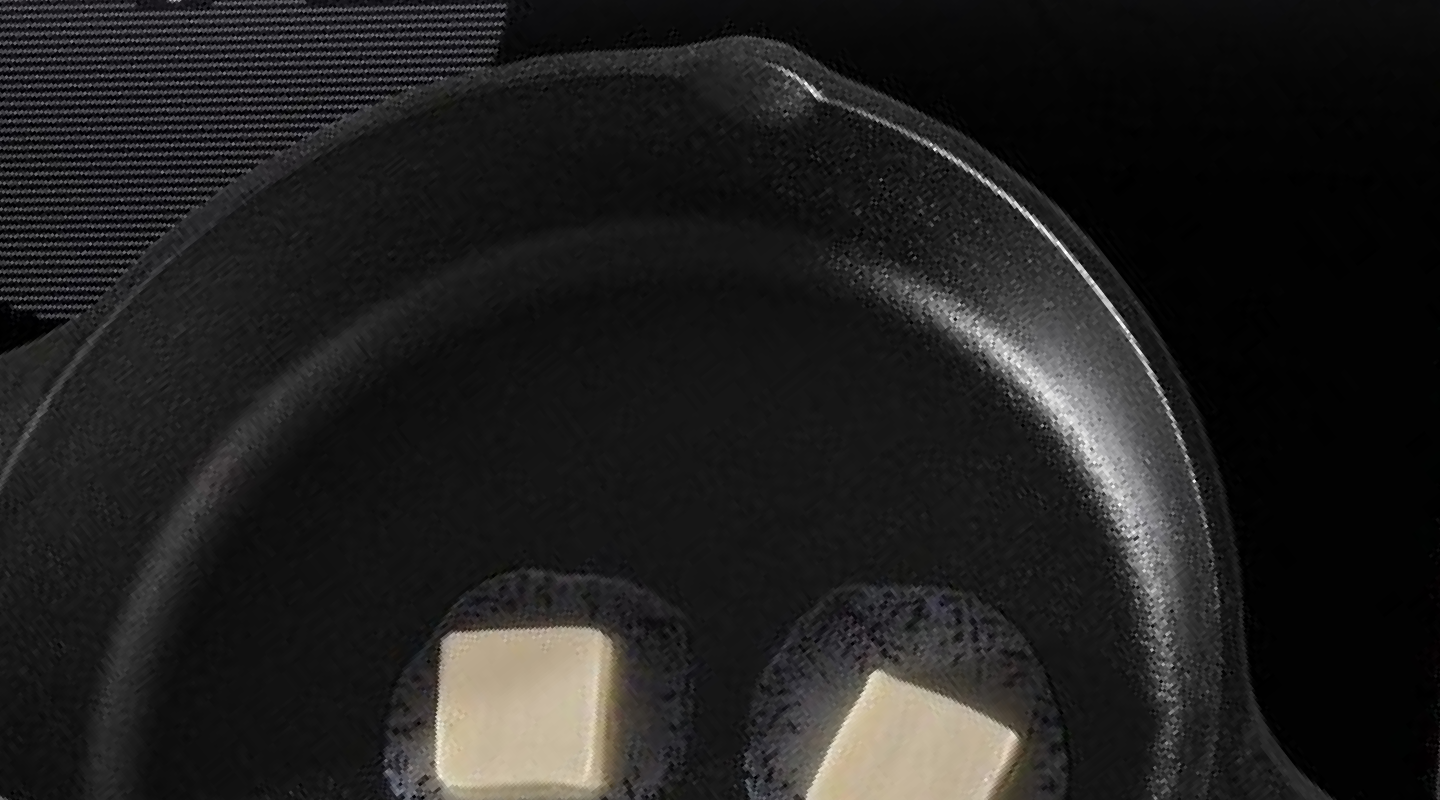 Cast iron skillet with melting butter inside