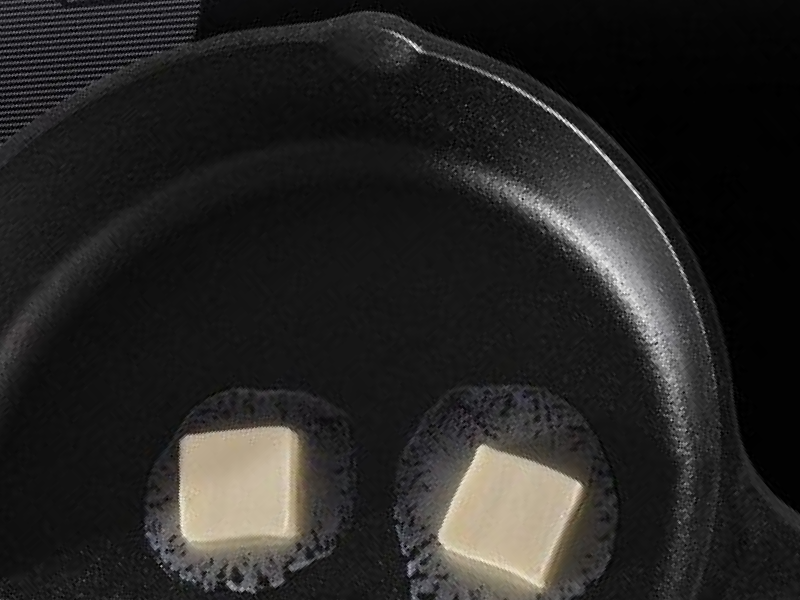 Cast iron skillet with melting butter inside