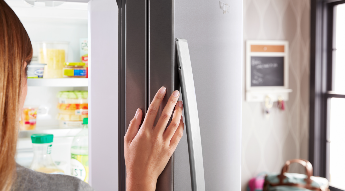 Person opening fridge