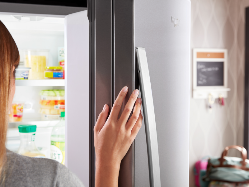 Person opening fridge