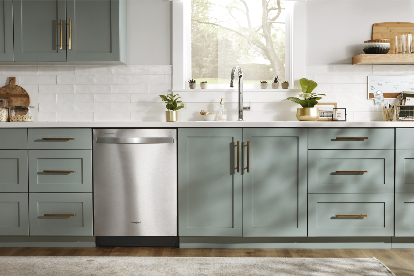 Stainless steel Whirlpool® top control dishwasher in a rustic kitchen