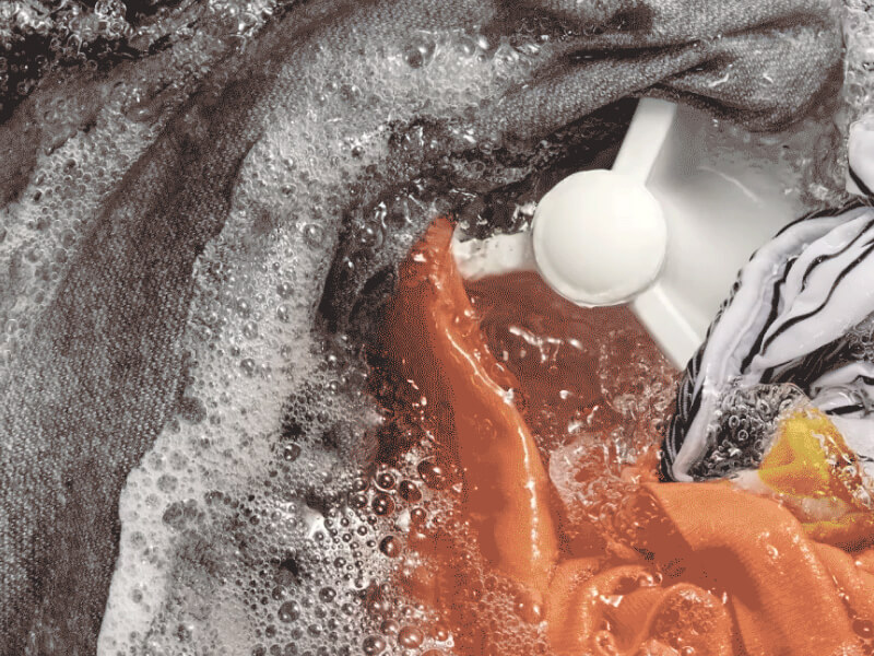 Clothes being washed inside a washing machine