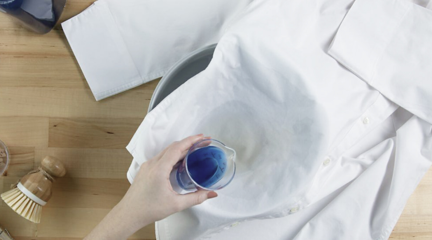 Person pretreating a stain