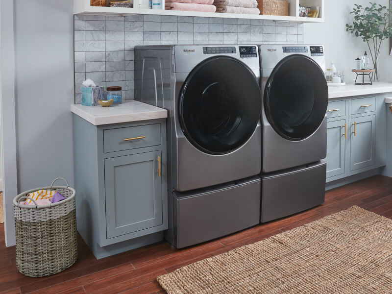 Whirlpool® Front Load Washer and Dryer in a laundry room