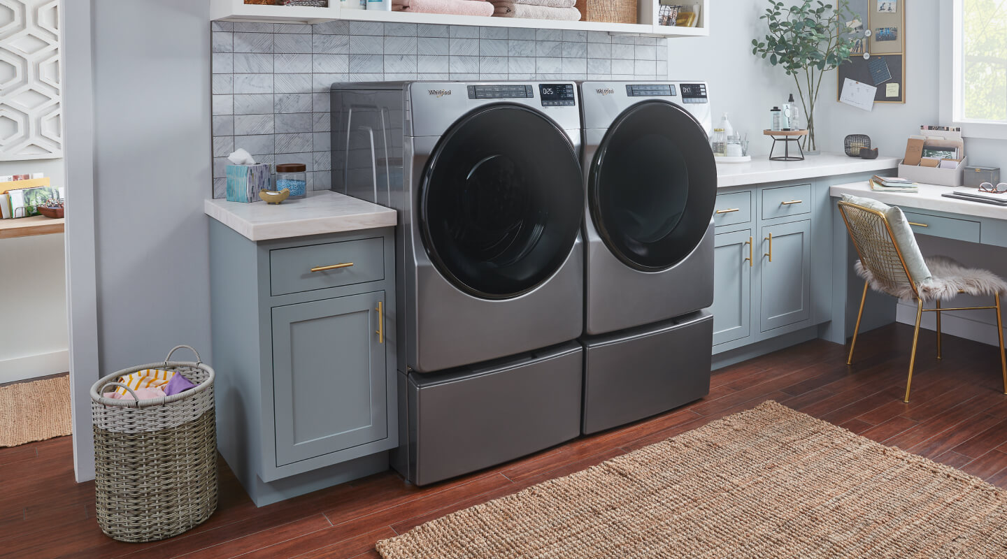 Whirlpool® Front Load Washer and Dryer in a laundry room